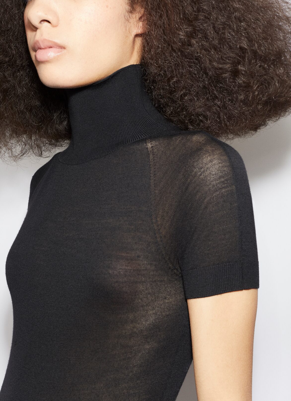 SHORT SLEEVE BODY IN SHEER WOOL KNIT ALAÏA BLACK SHORT SLEEVE BODY IN SHEER WOOL KNIT